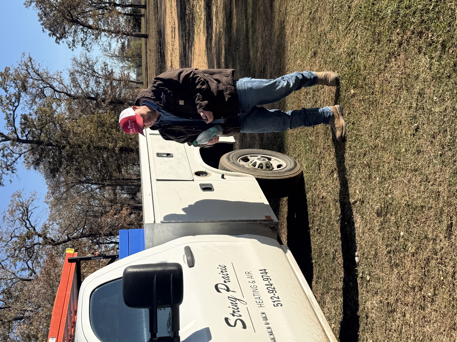 String Prairie Heating & Air team with service van